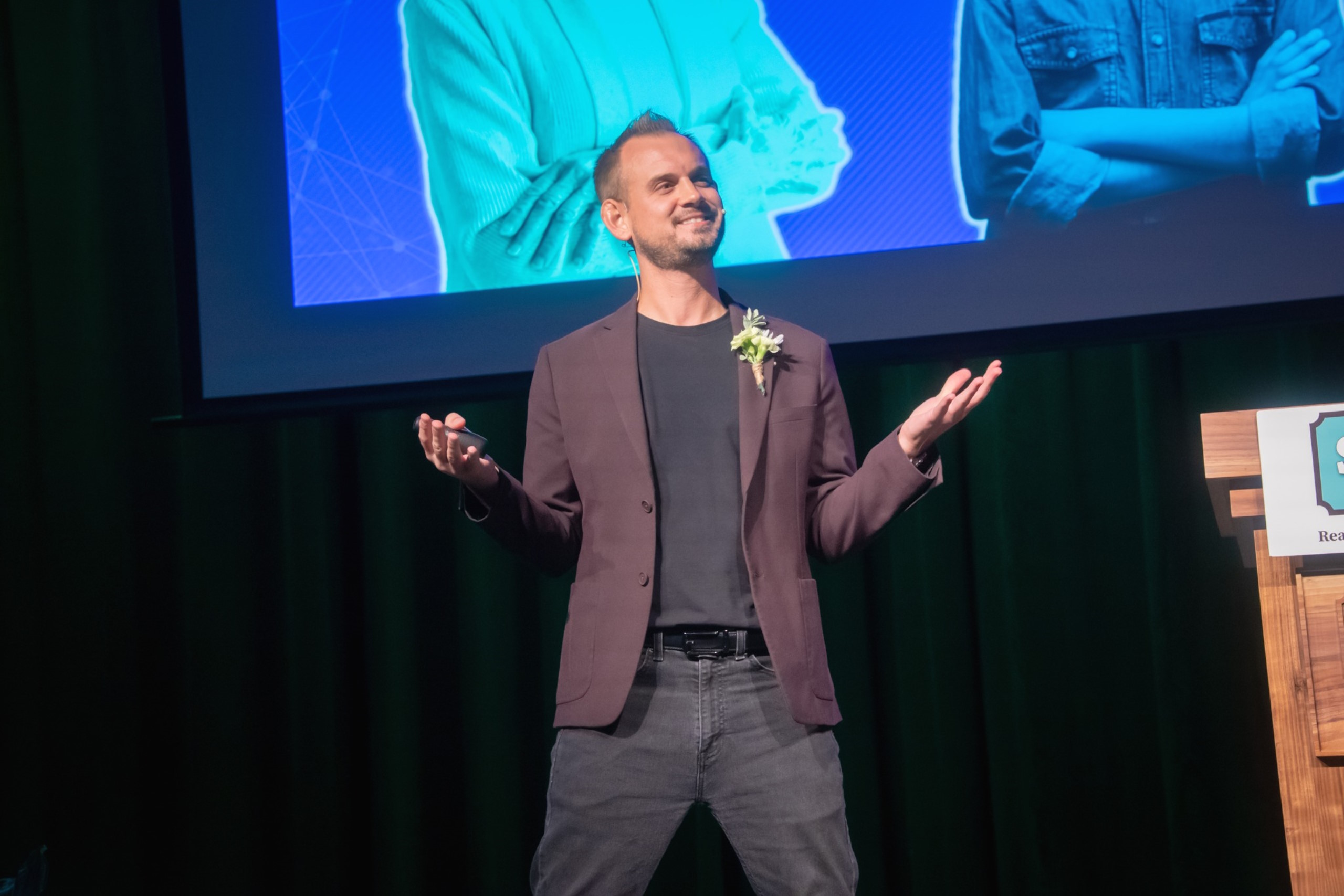 Luke Goetting speaking on stage